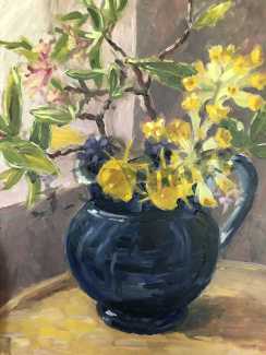Spring flowers picked from garden in a blue jug